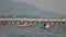 Local fishing boats anchor amid strong waves at Wannapha Beach, Bang Saen