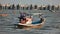 Local fishing boats anchor amid strong waves at Wannapha Beach, Bang Saen