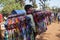 A local garment seller sells colorful garments in a local fair