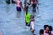 Local Ghana African People Swimming and having Fun in the warm Atlantic Ocean water