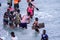 Local Ghana African People Swimming and having Fun in the warm Atlantic Ocean water