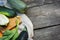 Local grown, green zucchini on a wooden background with place for text