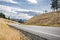 The local highway winding through the hills with dried grass provides transport links in the Columbia Gorge region