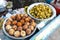 Local Indian food, Indian doughnuts and Rajasthan vegatarian dish on a market in Jodhpur, Rajasthan, India