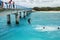 Local kids jumping off the Mouli Bridge between Ouvea and Mouli islands, Loyalty Islands, New Caledonia