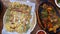 Local korean food vegetable pancake pajeon and pig spicy sauce with side dishes top view slow motion 4k