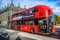 Local London public bus taking tourists places in the city of London