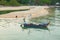 A local Malay fisherman sorting out his fishing net