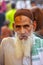 Local man portrait smoking at the street market in Fatehpur Si