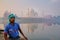 Local man sitting in a boat on Yamuna River near Taj Mahal in ea