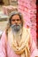 Local man sitting near hindu shrine in Mehtab Bagh Moonlight Ga