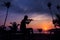 Local musicians, Asian man playing violin on the coconut beach with million stars galaxy