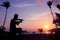 Local musicians, Asian man playing violin on the coconut beach at sunrise