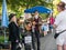 Local musicians chat with friends at Corvallis Farmers Market, O