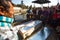 Local people during the cremation ceremony along the holy Bagmati River in Bhasmeshvar Ghat at Pashupatinath temple in Kathmandu.