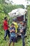 Local people in front of a homemade `ghost train` that run on abandoned railroad tracks