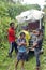 Local people in front of a homemade `ghost train` that run on abandoned railroad tracks