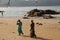 Local people at Gokarna Beach at dawn - Konkan Indian beach - Arabian sea - beach holiday