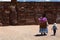 Local people at Kalasasaya temple wall. Tiwanaku archaeological site. Bolivia