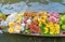 Local people sell fruits, food and souvenirs on boats at Damnoen Saduak Floating Market in Ratchaburi District, Thailand. Famous