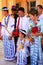 Local people in traditional costumes taking part in wedding ceremony at Mahamuni Pagoda, Mandalay, Myanmar