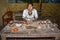 Local Quechua Ecuadorian indigenous woman displays pottery cups