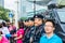 Local Residents of Shenzhen taking pictures with policemen on duty with weapons after Marathon game held in Shenzhen, China