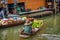 Local seller with bananas at a floating market in Thailand