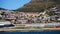 Local South African township housing residence area around Hout Bay hill side landscape from ocean