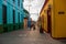 Local street with houses of colonial architecture. Santiago de Cuba, Cuba.