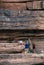 Local Thai fishermans working with fishing net on rock cliff shore of Mekong river