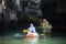 Local thai people guide paddle canoe boat of trip tour in sea ocean bring thai traveler women travel visit Prasat Hin Pan Yod in