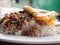 Local Thai rice topped with stir-fried pork basil and fried egg.