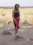 Local tourist guide leading a group down from Erta Ale active volcano in Afar Region in Ethiopia, Africa,