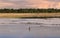 Local Tribal Man From Afar Peddling Early In The Morning At The River, Beautiful tropical river in the Philippines