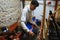 A local vendor uses a loom to create carpets in Fez, Morocco.