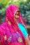 Local woman in colorful sari visiting Fatehpur Sikri in Uttar Pr