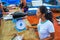 Local woman selling fish at the market in Puerto Ayora on Santa