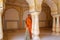 Local woman standing in Sattais Katcheri Hall, Amber Fort, Jaipur, India