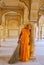 Local woman standing in Sattais Katcheri Hall, Amber Fort, Jaipur, India