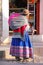 Local woman walking in the street of Chivay town, Peru