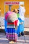 Local woman walking in the street of Chivay town, Peru