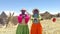 Local women on Lake Titicaca singing in native language, Uros Islands, Lake Titicaca, Peru