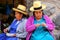 Local women sitting at the market in Ollantaytambo, Peru
