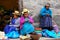 Local women sitting at the market in Ollantaytambo, Peru