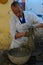 A local worker forms a ceramic piece in Fez, Morocco.