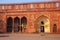 Local worker sweeping courtyard of Jahangiri Mahal in Agra Fort, Uttar Pradesh, India