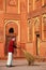 Local worker sweeping courtyard of Jahangiri Mahal in Agra Fort, Uttar Pradesh, India