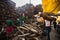 Locals near Holy Ganges weighed for sale wood for cremation.