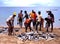 Locals sorting fish on the beach, Tobago.